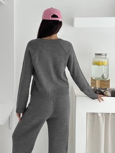 Chic dark grey knitted two-piece set featuring long sleeve top and high waist pants