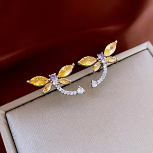 Elegant dragonfly earrings with yellow and purple zircons on silver pins in a gift box