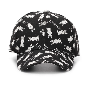 Close-up of black twill baseball cap with white rabbit print and LTRICH lettering