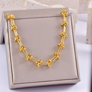 Chunky gold stainless steel link bracelet displayed on a premium jewelry box