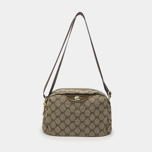 Brown oxford crossbody bag with BM print pattern and golden hardware on white background