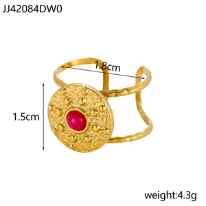 Detail view of gold titanium ring with red stone inlay, disk 1.5cm, weight 4.3g