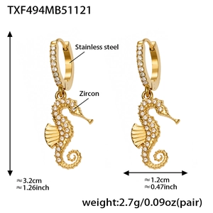 Detailed view of 18k gold plated stainless steel seahorse earrings with zircon stones