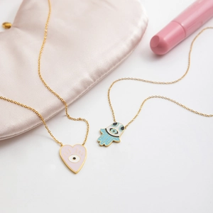 Gold stainless steel evil eye necklace with pink heart and blue Hamsa hand pendants