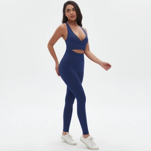 Detail of navy blue seamless yoga set showing cross-back sports bra and high-waist leggings