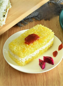 Detail of multi-layered sushi rice mold creating rectangular rice ball sandwiches