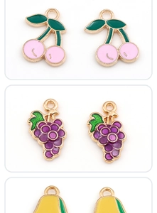 Detail of colorful enamel fruit pendants with gold alloy edges for DIY jewelry making