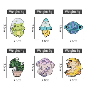 Cute cartoon enamel pins set featuring space frog, axolotl moon, and mushroom designs