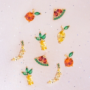 Gold-plated fruit stud earrings featuring vibrant zircon stones in a playful summer design