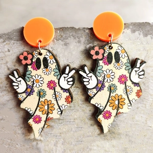 Macro detail of cute ghost wood earrings with vintage floral patterns for Halloween