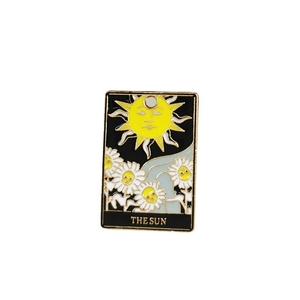 Enamel tarot card charm featuring the sun and sunflowers in a vintage gold frame