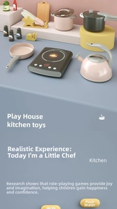 Macro view of kids toy kitchen set featuring induction cooker and assorted cookware