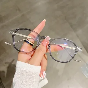 Minimalist transparent grey glasses frame with slim metal temples and non-slip tip details