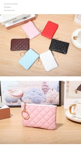 Close-up of quilted PU leather mini wallets with golden hardware on a wooden desk
