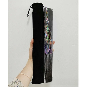 Folded colorful rainbow fan with a black velvet drawstring pouch shown in detail