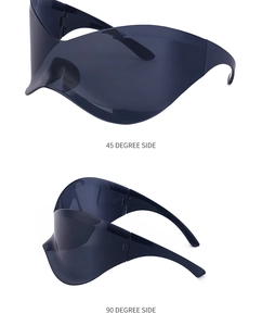 Detailed views of grey oversized frameless shield sunglasses at 45 and 90 degree angles