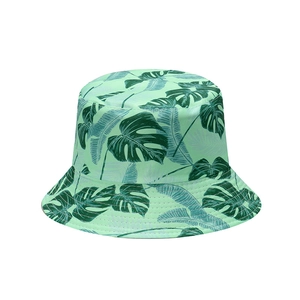 Mint green tropical fisherman hat with dark green Monstera leaf pattern for summer shade