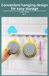 Detail of double-sided dish sponge with hanging loop and metal fiber cleaning surface