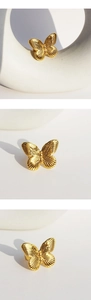 Detailed views of gold-plated 3D butterfly ring showing intricate wing textures from three angles