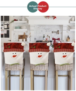 Detail of Christmas snowman chair covers set with red velvet and 3D carrot nose