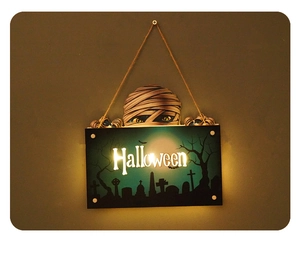 LED Halloween door sign featuring a mummy and spooky graveyard scene with blue light