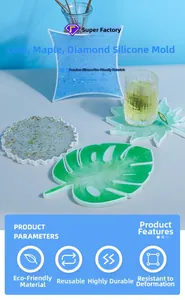 Macro detail of leaf-shaped silicone coaster molds with clear resin and gold foil flakes