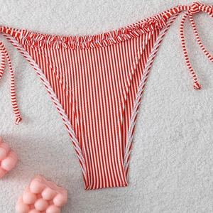 Detail of red and white striped bikini bottom with side ties and ruffle trim on fleece