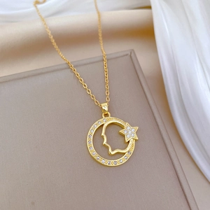 Elegant gold titanium necklace featuring a sparkling zircon star and moon ring pendant