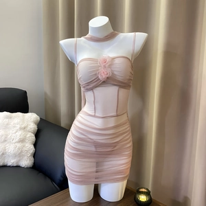 Detail of sheer mesh bodycon dress with pleated texture and 3D floral chest decor
