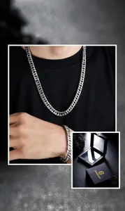 Detail of silver Cuban link necklace and bracelet set with black suspension gift box