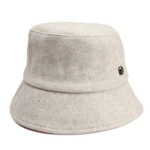 Oatmeal wool bucket hat with silver sequins and a small metal logo for winter