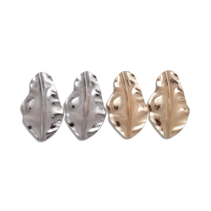 Irregular pleated leaf stud earrings in gold and silver finishes on white background