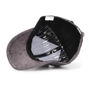 Detail view of the gray faux suede baseball cap showing inner lining and sweatband