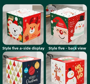 Detail view of square Christmas gift boxes with Santa, snowman and reindeer patterns