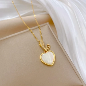 Elegant gold titanium steel heart necklace with shell inlay and cubic zirconia pendant