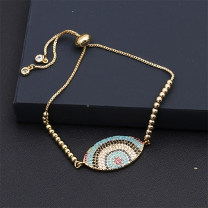 Detail of adjustable evil eye bracelet with colorful cubic zirconia and gold plating
