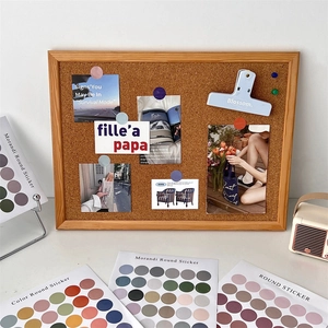 Close-up of Morandi color dot stickers and cork board set for creative desk decoration