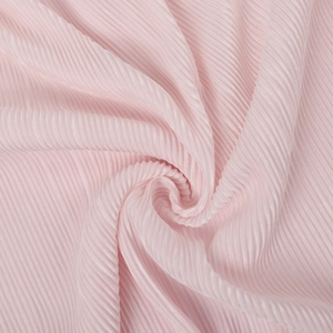 Macro detail of elegant pink pleated fabric texture with uniform vertical folds
