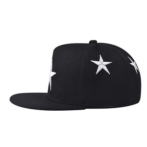 Close-up of white five-pointed star embroidery on a black cotton snapback hat