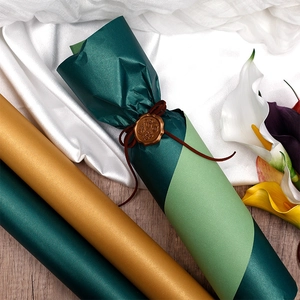 Extra large pearlized gift wrapping paper rolls in dark green, gold, and light green
