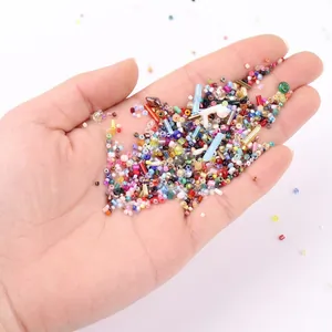 Assorted Miyuki glass beads and tube beads set held in hand for DIY jewelry making