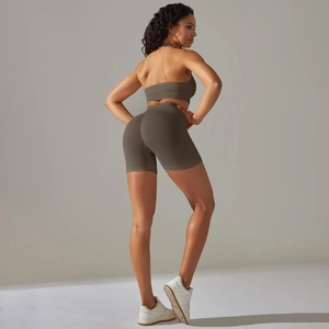 Detail of olive green seamless yoga set with ribbed fabric and cross-back sports bra