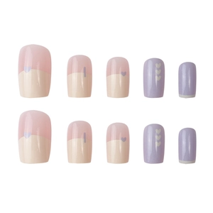 Pink and purple press-on nails set with cute heart patterns and stripes on white background