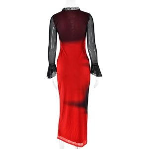 Detail view of the red body con dress featuring black mesh patchwork and bell sleeves