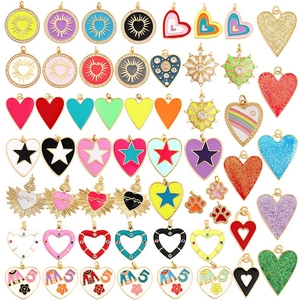 Flat lay of colorful enamel heart and star charms with crystal zircon for jewelry making
