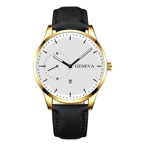 Detail of quartz watch with gold case, white dial, and black leather strap with date
