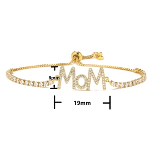 Macro shot of gold-plated MOM charm bracelet with measurements 19mm by 8mm