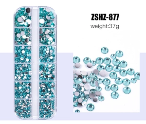 Teal acrylic rhinestones in 12-grid storage box for nail art and DIY decoration