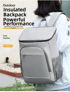Detail view of a large grey insulated outdoor backpack showing side mesh pockets and straps