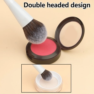 Detailed double-headed makeup brush with white handle showing blush and powder use